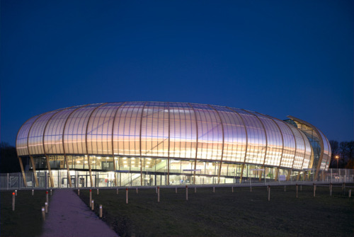 archatlas:  Limoges Concert Hall Bernard Tschumi Architects “The concept for the project began with a double envelope: an outer skin made of wood arcs and translucent rigid polycarbonate sheets and an inner acoustical envelope of locally grown