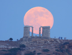  Super Moon Rises over The Temple of Poseidon “Yesterday’s view from Sounion, Greece. The visitors of the ancient Greek temple of Poseidon watch the perigee full moon rising, but i was photographing the scene from 2km (1,2 miles) at their back.”