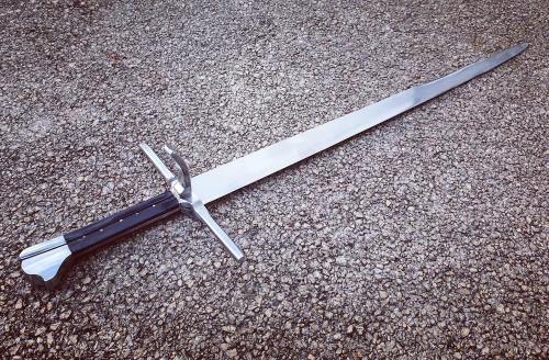 A Long Knife, late XVth century. Slender single-edged blade of spring steel with a false edge on the