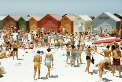 artis-useless:  natgeofound: South Africans relax on a sunny, cabana-lined beach in Cape Town, South Africa, August 1953.Photograph by Dr. Gilbert H. Grosvenor, National Geographic   
