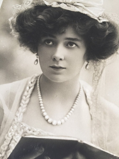 Beautiful Antique Beauty Miss Hilda Coral posing in a wonderful hat with bow, earrings, pearl neckla