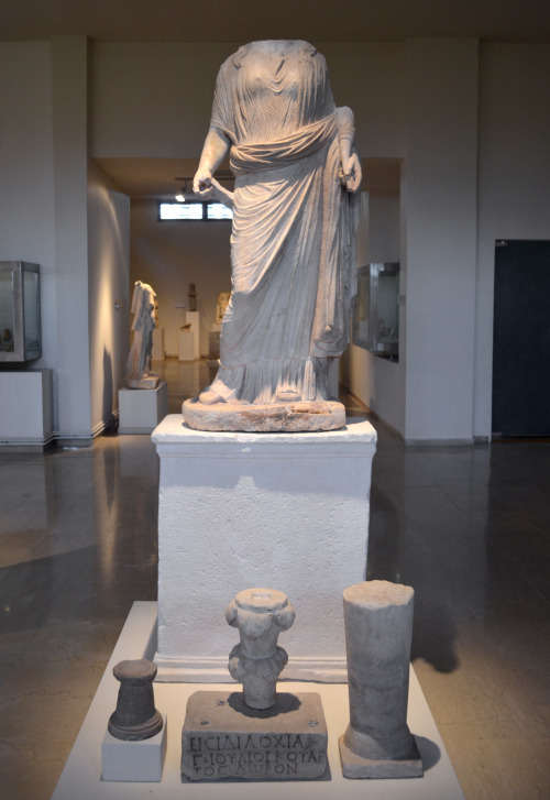 greek-museums:Archaeological Museum of Dion:Statue to Isis Tyche, and other votives, including one d