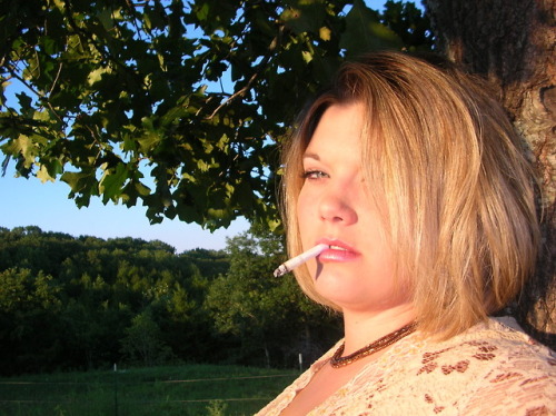 captkmnus: Nikki (1 of 2) Love her smoking style she needs a cock to suck on