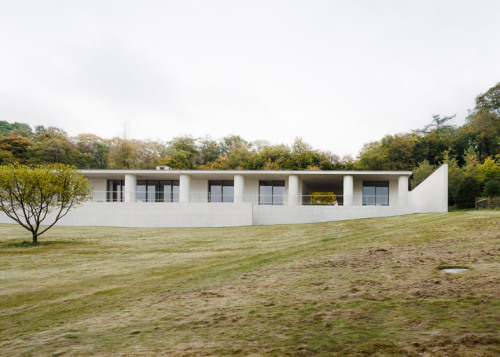 {Loving the light and spaces in this home by favourite minimalist David Chipperfield.} The house is 