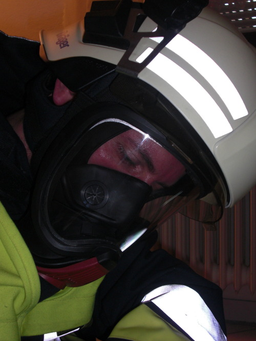 Some escape training in firefighting gear