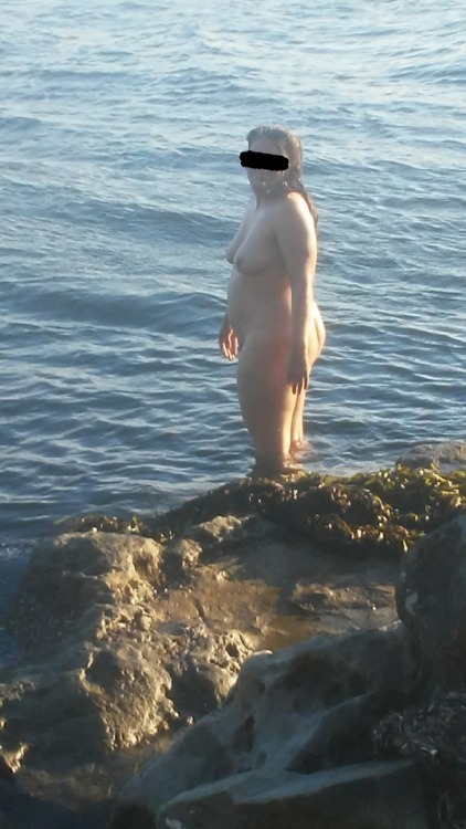 eroticcouplepnw: My gorgeous goddess wife enjoying some cool ocean last summer at the nude beach