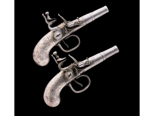 A pair of silver mounted flintlock pocket pistols produced by H. Devillers of Liege, Belgium, circa 