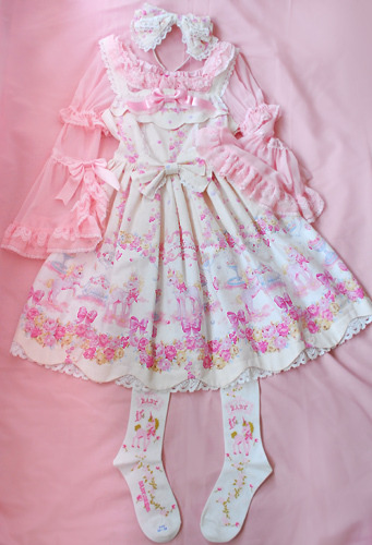 lovely lolita coords laid out on beds & floors