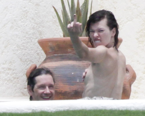 toplessbeachcelebs:  Milla Jovovich (Actress) in a jacuzzi topless in Los Cabos (August 2011)