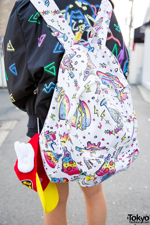 Aipanda and Tashu - both 17 years old - on the street in Harajuku wearing graphic outfits by Galaxxx