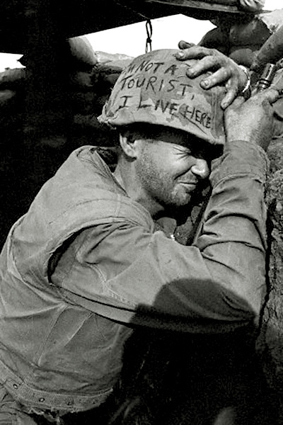 vietnamwarera:“I’m not a tourist, I live here,” written on the helmet of a US Marine at Khe Sanh, 19