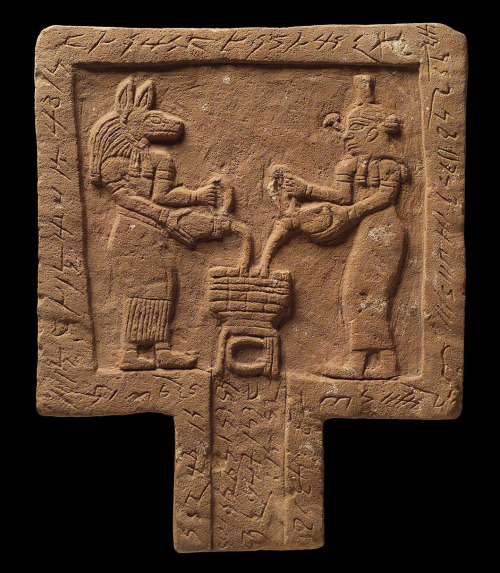 dwellerinthelibrary:A Meroitic offering table, showing Anubis and Nephthys pouring libations (liquid