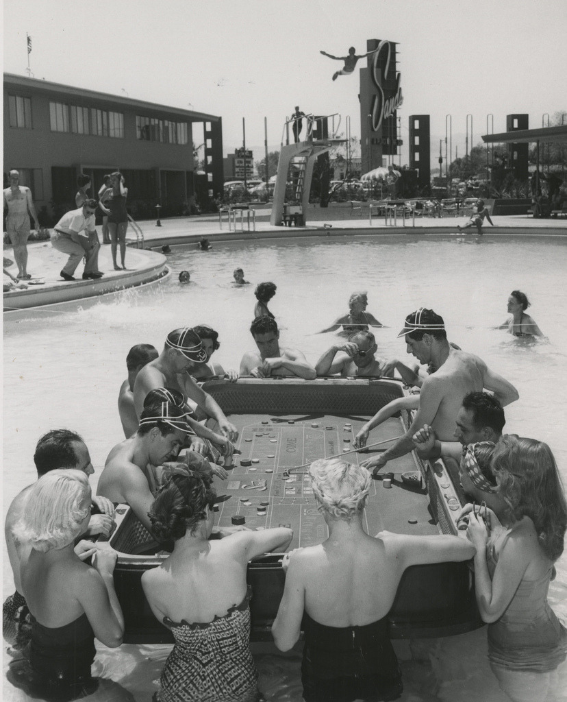 indypendent-thinking:  Photograph of a floating craps game in the Sands Hotel swimming