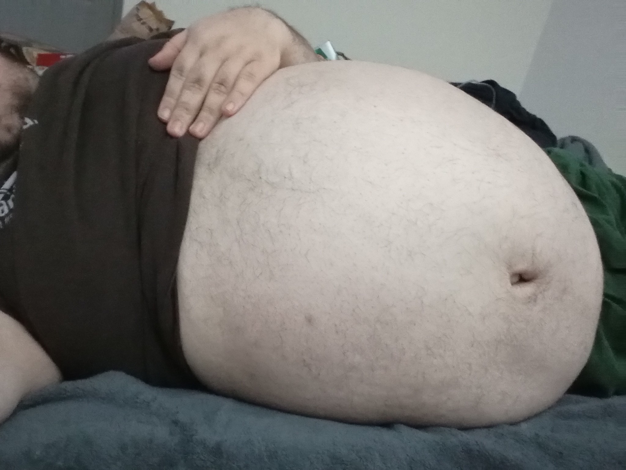 earthyjim:bigbellyct:Celebrated Pi day. Bloated and beached on the bed. Time for