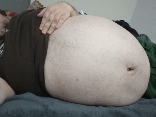 earthyjim:bigbellyct:Celebrated Pi day. Bloated and beached on the bed. Time for