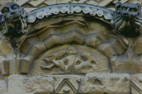 A Sheela Na Gig holds two fish in an unusual depiction carved into Rochester Cathedral along with ot