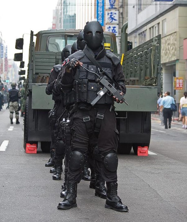 Black MaskTaiwanese soldiers with an interesting, if not intimidating piece of equipment.