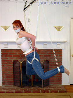 vaultofbondage:  Jane in a flying suspension