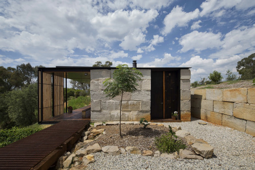 cjwho:  SawMill House, Australia by Archier Studio |via  From the architect: The Sawmill House uses large reclaimed one tonne blocks of reclaimed concrete which anchor it into the landscape and a dynamic active building envelope to regulate the internal