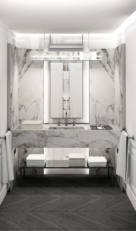{The glamour and luxury continues in the hotel suites! Creamy white marble with highly polished meta