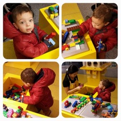 #berlinbenjamin having fun at the Lego store and getting some professional Lego training from the lady at the store lol