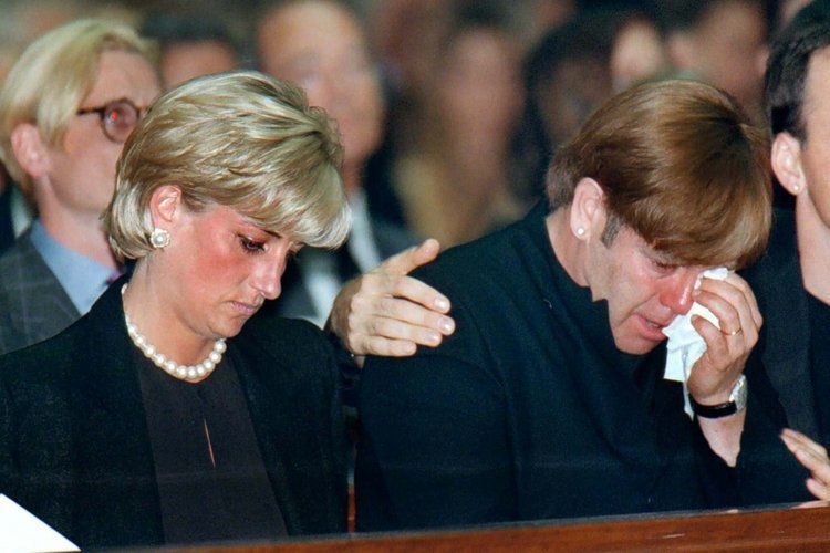  Princess Diana and Elton John at the funeral of their friend, Gianni Versace, in