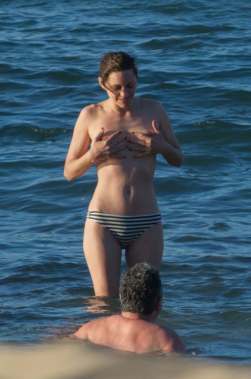 toplessbeachcelebs:  Marion Cotillard (Actress) topless in the Canary Islands (May 2016) Fans of large aerolas are in for a treat! French actress Marion Cotillard was in the Canary Islands shooting her upcoming film Allied with Brad Pitt when she decided