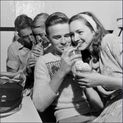 stockingsandstilton:  Teenagers sharing milkshakes,