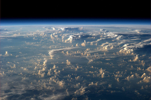 sixpenceee:  Clouds cast thousand-mile shadows into space when viewed aboard the International Space Station 