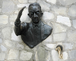 sixpenceee:  In Montmartre, Paris you might bump into this great sculpture, Le Passe-Muraille (the Passer-Through-Walls). Le Passe-Muraille is the title of a story by Marcel Aymé about a man named Dutilleul who discovers that he can walk through walls.