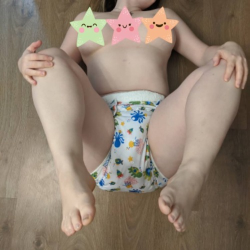 abgirlanddaddy:Cuteness overload, someone is loving being pinned into a cloth nappy, and the cover j