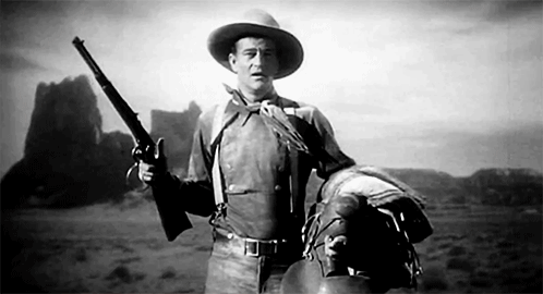 John Wayne Flip Cocking, Or Spin Cocking, His Winchester In Stagecoach (above, 1939) And True Grit (below,
