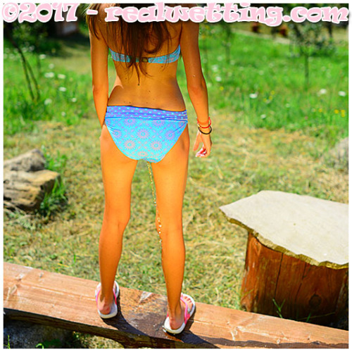 Beatrice is sunbathing and after a while she takes a pee break in her swimsuit. Lovely girl !