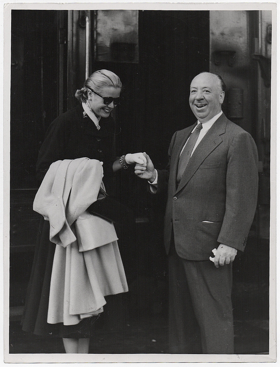 gracefilm:  Alfred Hitchcock welcomes Grace Kelly at the train station for the 1954