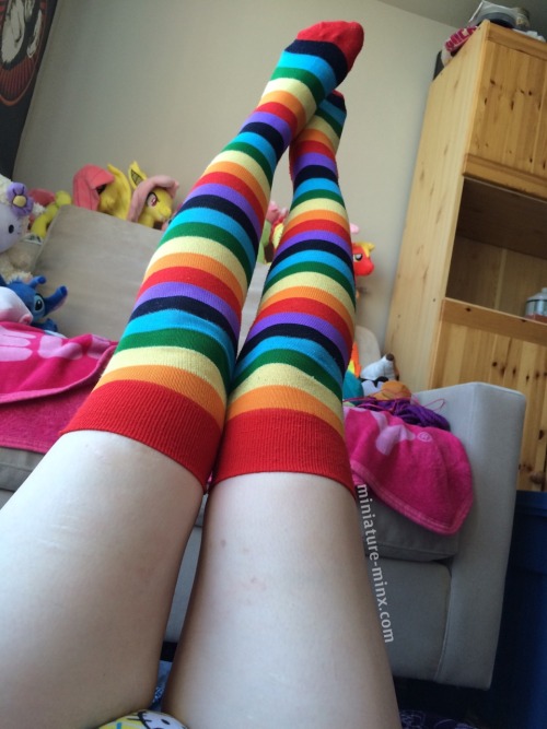 miniature-minx:  Relaxing in my little corner ^-^   Rainbow thigh highs from @bdsmgeekshop 