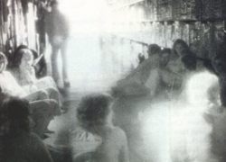 sixpenceee:  Toys R Us GhostThis infrared photograph was taken during a paranormal investigation at a Toys R’ Us in Sunnyvale, California. The man leaning against the shelves in the background was not seen with the naked eye. Other shots taken at the