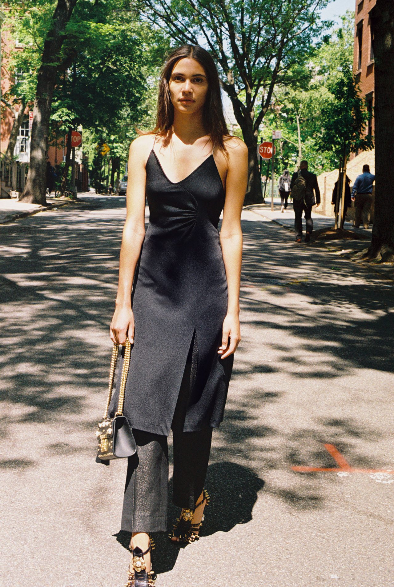 Kaya Wilkins in a vintage black dress and