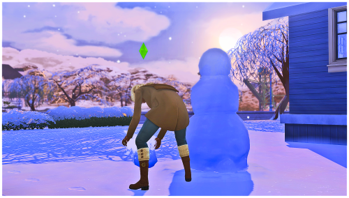 just a pregnant bby building a snowpal as the sun sets