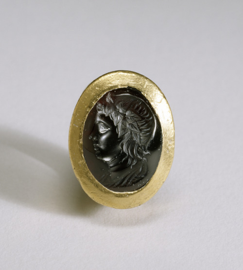 Ancient Greek gold ring with a garnet intaglio, depicting either the god Dionysus himself or Ptolemy