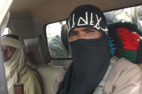 Members of the Islamist group Ansar Dine standing guard at the Kidal Airport, on August 7, 2012.&gt;