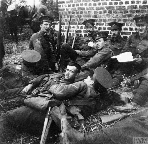 scrapironflotilla: Men of the Oxford and Buckinghamshire Light Infantry sheltering from shrapnel beh