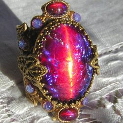 sixpenceee:Dragon’s breath is a collectors nickname for stones made of glass mixed with metals to induce a bi-color effect ranging from red to blue with an overall bright blue or purplish cast; flashes of color from within the stone are known as the