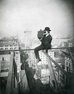 Charles C. Ebbets takes a photo from atop