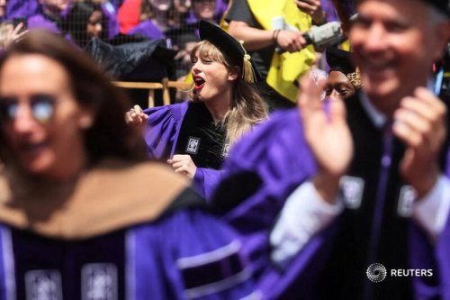 diagon-alli:  @reuterspictures: Taylor Swift attends the NYU graduation ceremony at Yankee Stadium i