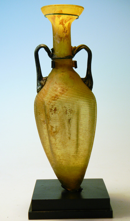 rodonnell-hixenbaugh: Roman Glass Amphora An ancient Roman large glass amphora with a yellow swirled