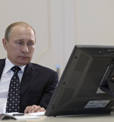 voidfoxstarlight:[ID: The first image is a photo of Putin looking at a computer. The second image is