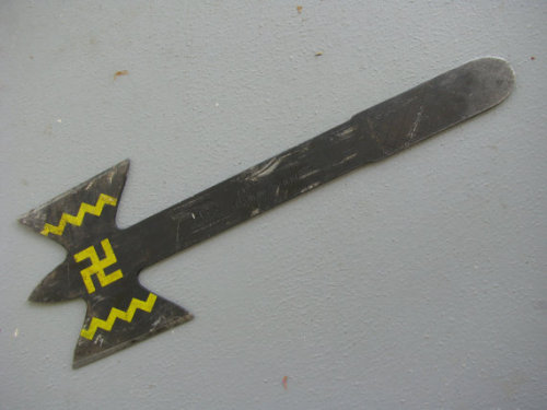 A mail-order Apache souvenir throwing tomahawk featuring a swastika on its blade, from around 1952. 