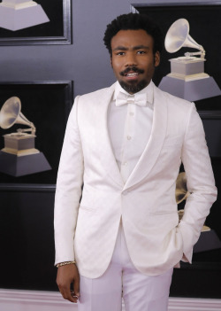poisonedblacklotus: beaux-knows:   hoezferatu:  celebsofcolor:  Donald Glover attends the 60th Annual GRAMMY Awards at Madison Square Garden on January 28, 2018 in New York City.  Looking like a fly Colonel Sanders    Look like he own a couple plantations
