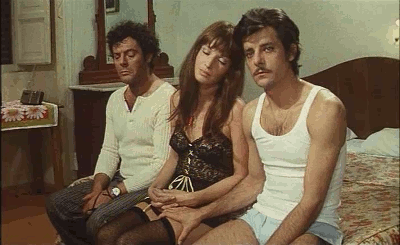  Marcello Mastroianni, Monica Vitti e Giancarlo Giannini.“Dramma della gelosia - Tutti i particolari in cronaca” (Ettore Scola, 1970). 