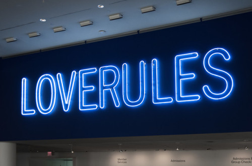 Hank Willis Thomas’s neon installation poetically affirms the importance of love and compassio